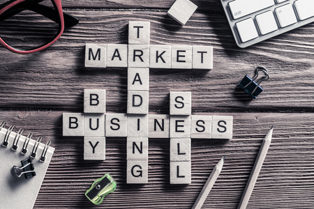 Conceptual business keywords on table with elements of game making crosswordの写真素材