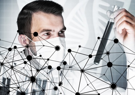 Portrait of concentrated male scientist working with reagents in laboratoryの写真素材