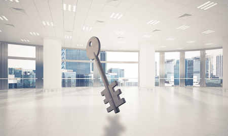Key stone figure as symbol of access in elegant office room. 3D renderingの写真素材