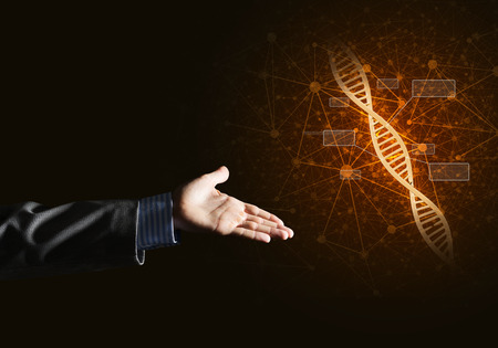 Close of businessman hand presenting DNA molecule research as concept. Mixed mediaの写真素材