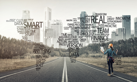 Female construction worker on road and globalisation conceptの写真素材