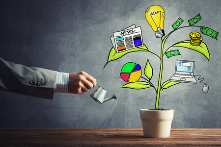 Hand of businessman watering concept of business plan and strategyの写真素材
