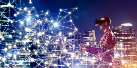 Young man with virtual reality headset or 3d glasses among connection linesの写真素材