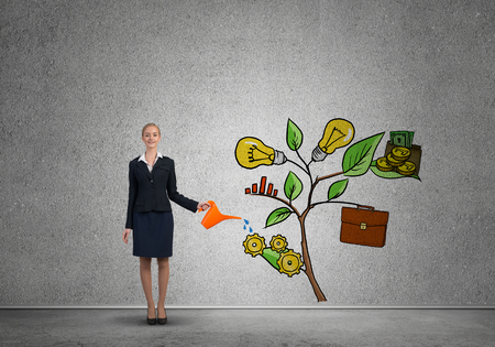 Attractive businesswoman presenting investment and financial growth conceptの写真素材