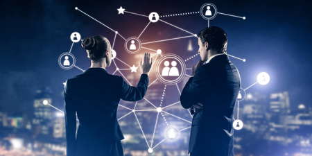 Businessman and businesswoman standing with back and touching connection conceptの写真素材