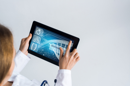 Tablet pc device with medicine interface screen in hands of doctorの写真素材