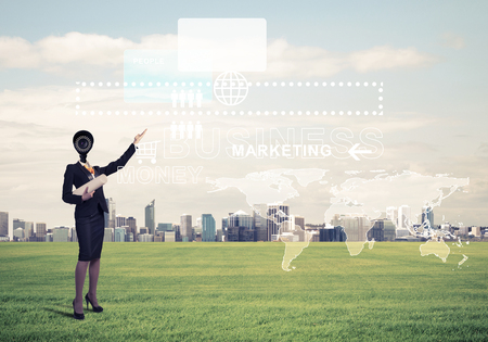 Elegant businesswoman outdoors with camera instead of head and media interface on screenの写真素材