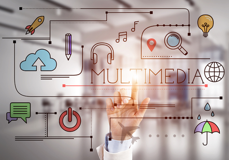 Hand of businesswoman touching business colored sketched concept on screenの写真素材