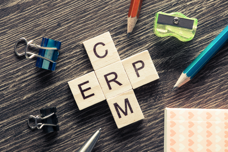 Words of business marketing collected in crossword with wooden cubesの写真素材