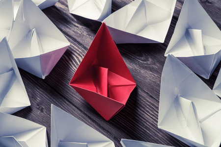 Set of origami boats on wooden tableの写真素材