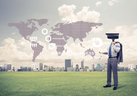 Elegant businessman outdoors with camera instead of head and media interface on screenの写真素材