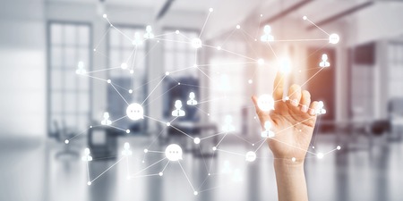 Close up of businesswoman hand touching network concept on screenの写真素材
