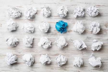Set of crumpled paper balls with one colorfulの写真素材