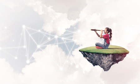 Cute smiling girl on floating island presenting social connection conceptの写真素材