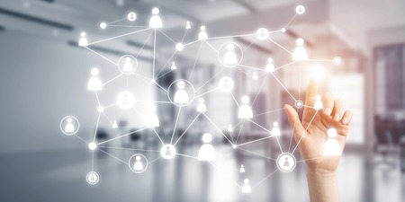 Close up of businesswoman hand touching network concept on screenの写真素材