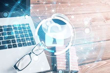 Opened laptop and other office stuff on wooden tableの写真素材