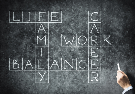 Business concept with crossword drawn with chalk on blackboardの写真素材