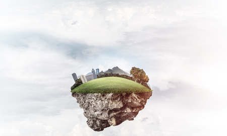 Eco green concept with cityscape on island floating in skyの写真素材