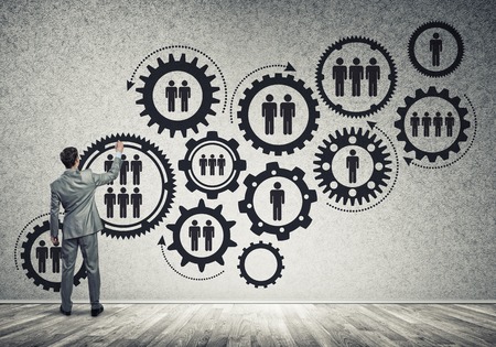Businessman standing with back and drawing concept of teamwork and cooperationの写真素材