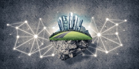 Beautiful small island with grass and cityscape on concrete backgroundの写真素材
