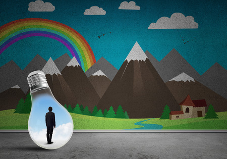 Businessman inside light bulb in room against nature drawn conceptの写真素材