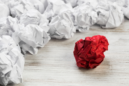 Set of crumpled paper balls with one colorfulの写真素材