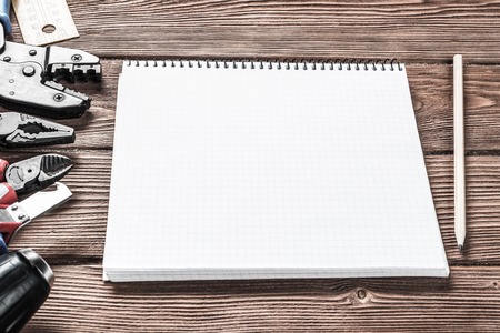 Variety of repair tools on wooden surface and place for text