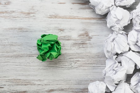 Set of crumpled paper balls with one colorfulの写真素材