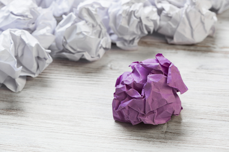 Set of crumpled paper balls with one colorfulの写真素材