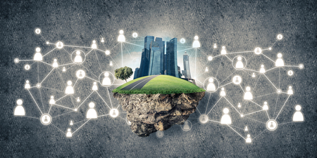 Beautiful small island with grass and cityscape on concrete backgroundの写真素材