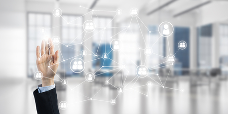 Close up of businesswoman hand touching network concept on screenの写真素材