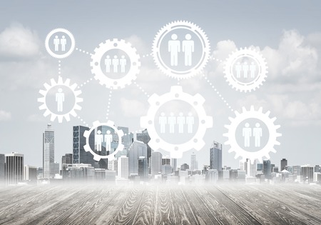 Modern cityscape and social connection gear concept on screenの写真素材