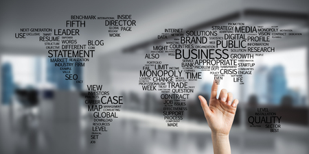 Close of businesswoman hand touching global business concept on screenの写真素材