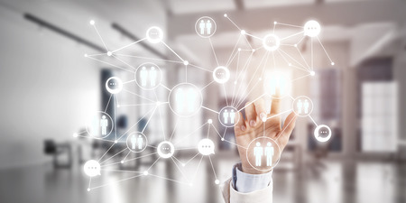 Close up of businesswoman hand touching network concept on screenの写真素材