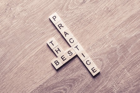 Words of business marketing collected in crossword with wooden cubesの写真素材