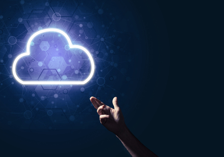 Male hand pointing to the luminous cloud computer concept