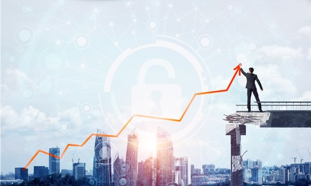 Businessman in suit drawing graphs on modern statistical media interface while standing on broken bridge with cityscape and sunlight on background. 3D rendering.の写真素材