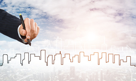 Hand of man designer drawing with stylus construction projectの写真素材