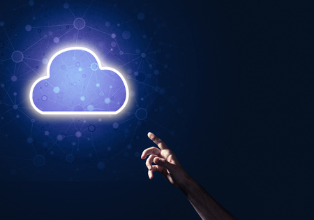 Male hand pointing to the luminous cloud computer concept