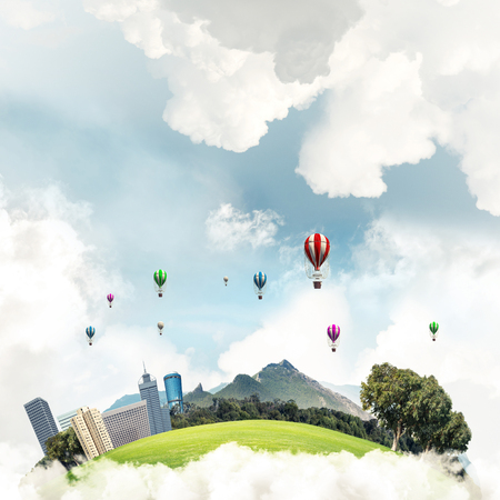 Green flying island with urban view of towers and skyscrapers. Flying aerostates and blue cloudy skyscape on background. 3D rendering.の写真素材