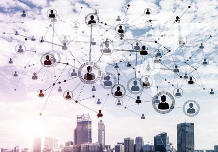 Modern cityscape with buildings and skyscrapers and social connection concept on screenの写真素材