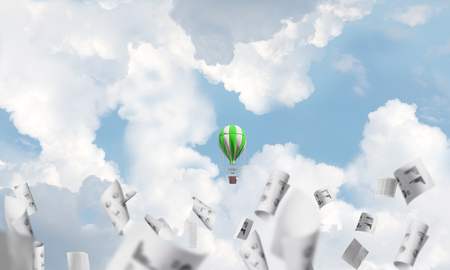 Colorful aerostat flying among paper documents and over the blue cloudy sky. 3D rendering.の写真素材