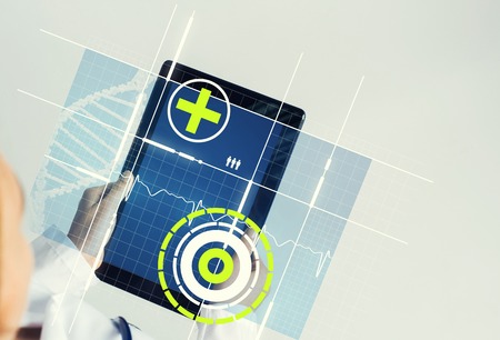 Tablet pc device with medicine interface screen in hands of doctorの写真素材