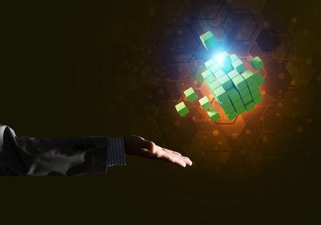 Close of businessman hand holding cube figure as symbol of innovation. 3D renderingの写真素材