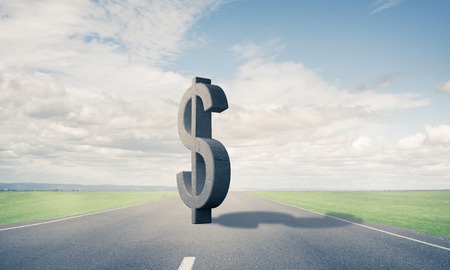 Stone dollar symbol on natural landscape as currency signの写真素材