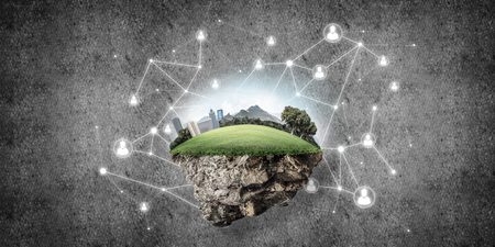 Beautiful small island with grass and cityscape on concrete backgroundの写真素材