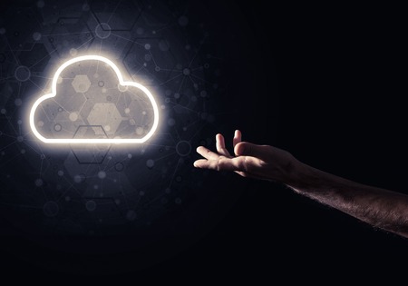 Man hand holding cloud computing concept in palm