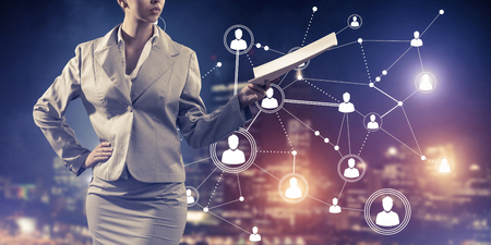 Close of businesswoman holding papers in hand and connection lines at backgroundの写真素材