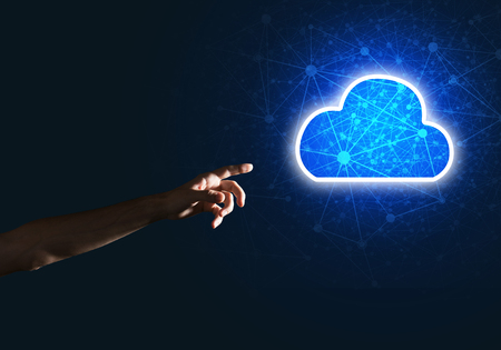 Male hand pointing to the luminous cloud computer concept