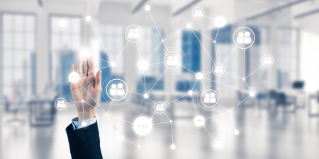Close up of businesswoman hand touching network concept on screenの写真素材